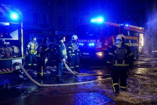 Rescue workers at the scene in Kyiv during the early hours of Saturday morning